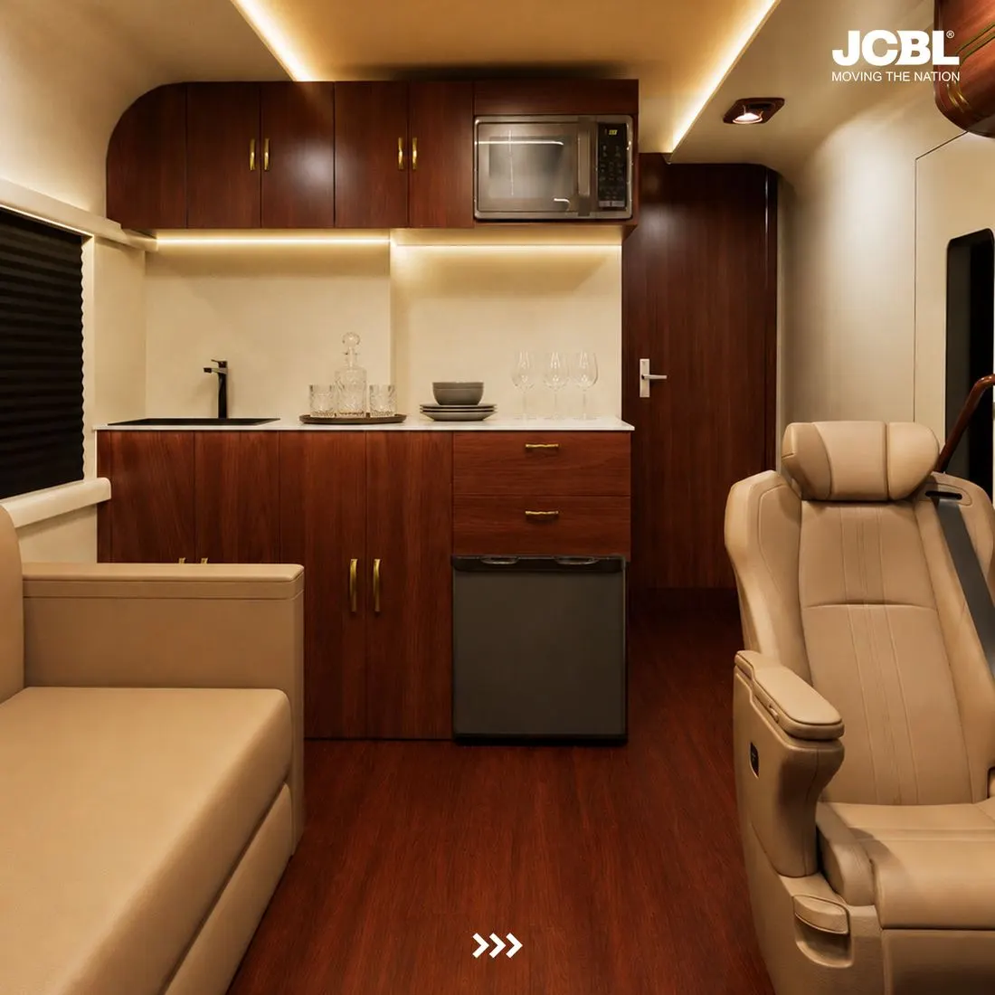 Compact galley kitchen with walnut cabinetry, sink and appliances