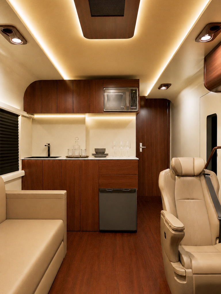 Compact galley kitchen with walnut cabinetry, sink and appliances